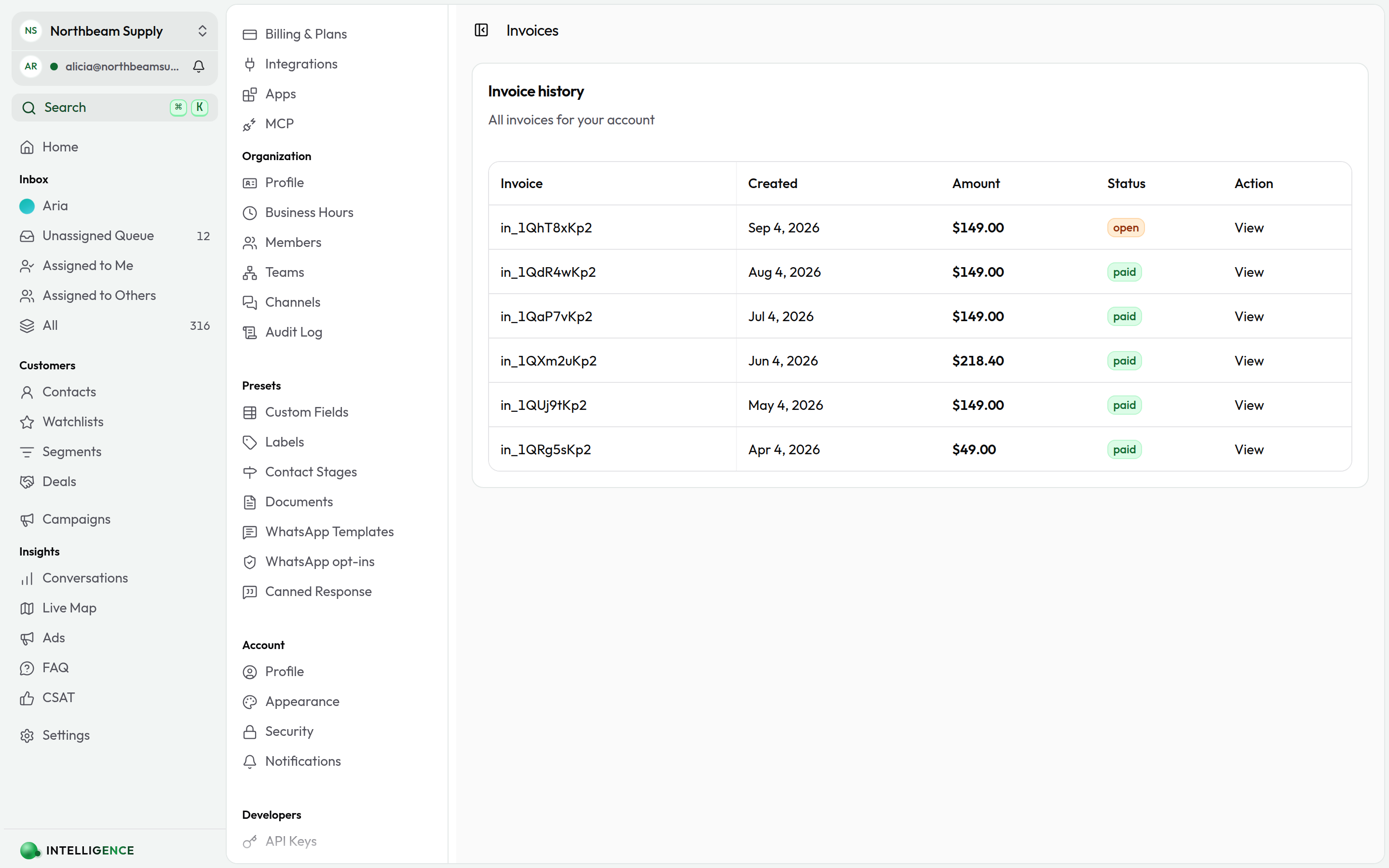 The Invoices page showing invoice history with amounts, statuses, and a View link per row
